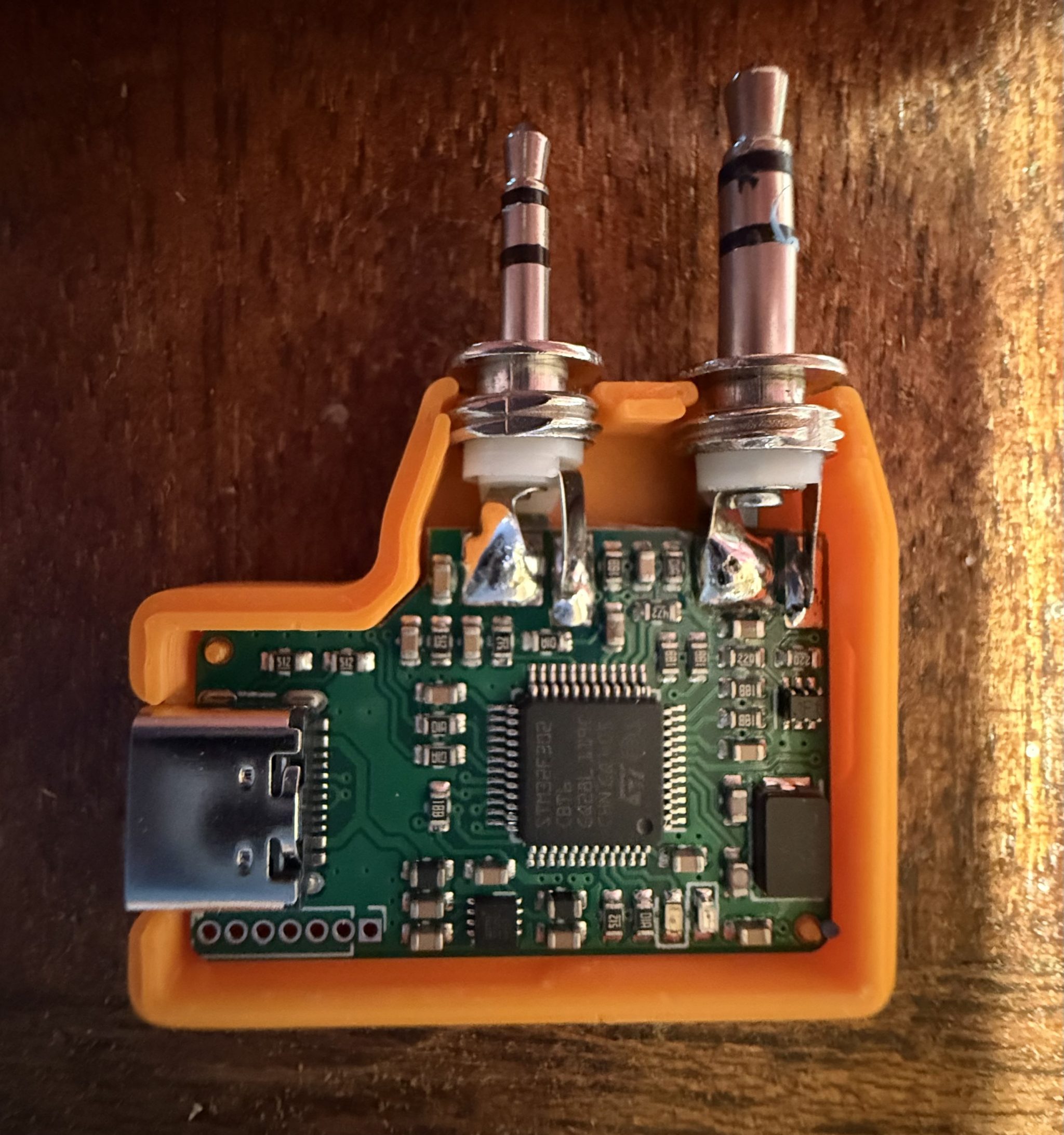 Fitting the AIOC into the 3D printed case.