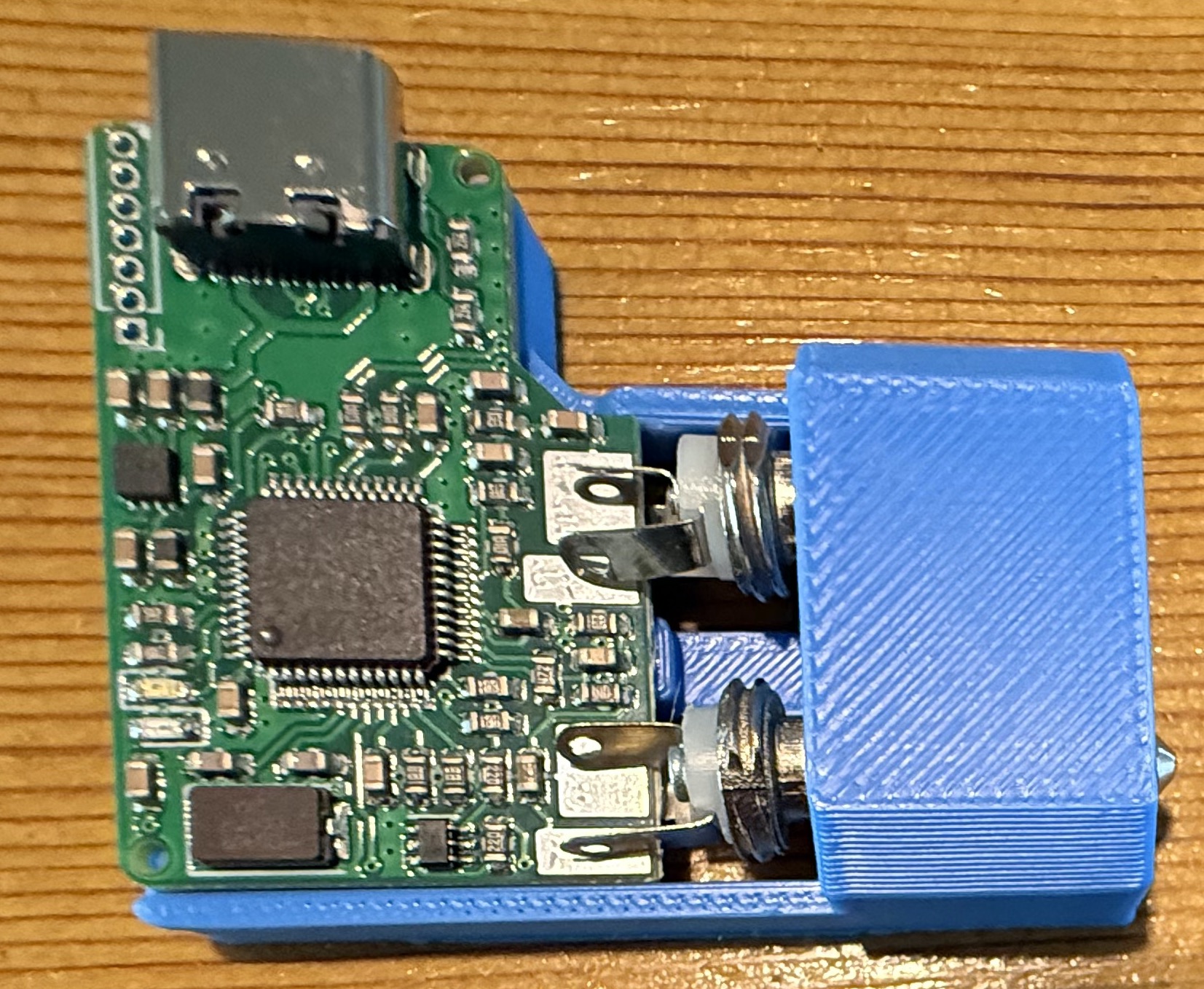 Fitting AIOC board into the solder jig.